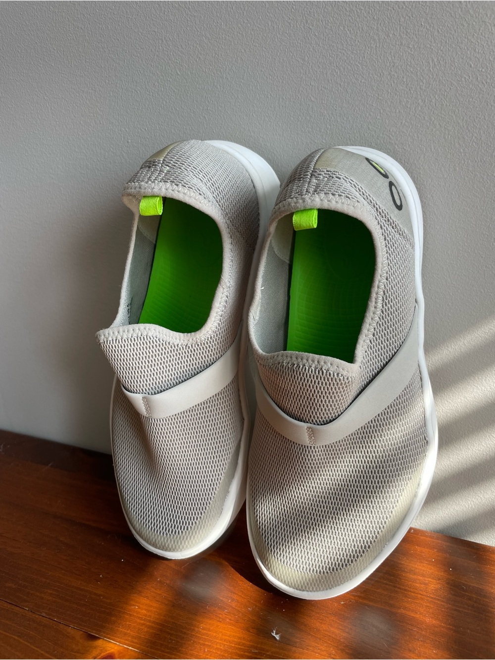 OOFOS Women's Slip-On Sneakers in Light Gray with Neon Green Insole